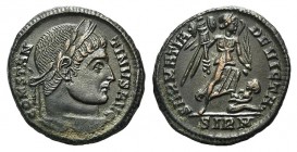 Constantine I (307/310-337). Æ Follis (18.5mm, 3.22g, 12h). Sirmium, 324-5. Laureate head r. R/ Victory walking r., holding trophy and palm; captive b...