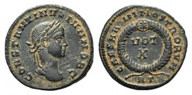 Constantine II (Caesar, 316-337). Æ Follis (17mm, 2.44g, 6h). Rome, AD 321. Laureate head r. R/ Wreath enclosing VOT/X in two lines; RT. RIC VII 243. ...