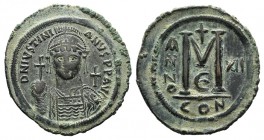 Justinian I (527-565). Æ 40 Nummi (43mm, 23.10g, 6h). Constantinople, year 12 (538/9). Helmeted and cuirassed bust facing, holding globus cruciger and...