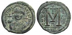 Justinian I (527-565). Æ 40 Nummi (40mm, 22.82, 6h). Antioch, year 13 (539-540). Helmeted, pearl-diademed and cuirassed bust facing, holding globus cr...