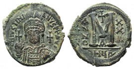 Justinian I (527-565). Æ 40 Nummi (35mm, 21.24g, 6h). Antioch, year 22 (548/9). Facing helmed and cuirassed bust, holding globus cruiciger. R/ Large M...
