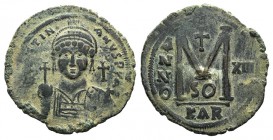 Justinian I (527-565). Æ 40 Nummi (40mm, 21.47g, 4h). Carthage, year 13 (539/40). Helmeted and cuirassed bust facing, holding globus cruciger and shie...