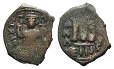 Islamic, Arab-Byzantine, c. 660s-680s. Æ Fals (22mm, 4.94g, 6h), Emperor standing facing, holding long cross and globus cruciger. R/ Cursive M; ANA to...