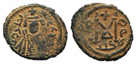 Islamic, Arab-Byzantine, c. 670s-early 680s. Æ Fals (24mm, 4.36g, 11h). Tartus (Antaradus) mint. Facing imperial bust. R/ Large M; crescent and cross ...