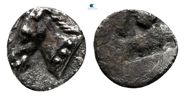 Aeolis. Kyme circa 500-475 BC. 
Tetartemorion AR

6 mm., 0,19 g.

Horse's h...