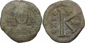 Justinian I (527-565). AE Half Follis, Constantinople mint. D/ DN IVSTINIANVS PP AVG. Helmeted and cuirassed bust facing, holding globus cruciger and ...