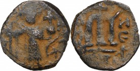 Umayyad Caliphate. Arab-Byzantine coinage (Pseudo-Byzantine type). AE Fals, circa 660s. D/ Standing imperial figure, holding long cruciform sceptre an...