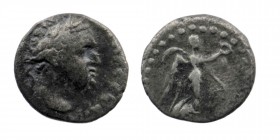 CAPPADOCIA, Caesarea-Eusebia. Titus. AD 79-81. AR Hemidrachm
Laureate head right 
Rev: Victory advancing right, holding wreath and palm frond. 
RPC II...
