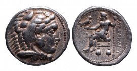 Kings of Macedonia, Alexander III the Great, 336-323 BC, lifetime issue, Tyre Mint, dated year 26, ca. 324-323 BC.
Head of Herakles wearing lion's sca...