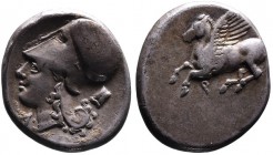 Corinthia, Corinth, ca. 375-300 BC.
Pegasus flying left, below q (koppa);
Head of Athena in corinthian helmet left, A below chin, astragal behind head...