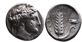 Lucania, Metapontum, ca. 340-330 BC.
Head of Demeter wearing wreath of corn and earrings right;
Ear of barley with leaf to right with cantharus on top...