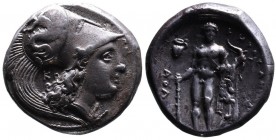 Lucania, Herakleia. Circa 330-281 BC.
Head of Athena wearing Corinthian helmet decorated with Skylla hurling a stone, to right; behind, K. 
Rev. Naked...