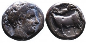 Campania, Neapolis, ca. 300-275 BC.
Head of nymph wearing headband and earrings right; behind head X;
Man-faced bull standing right, head facing, bene...