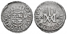 Carlos II (1665-1700). 1 real. 1700. Sevilla. (Cal 2008-760). Ag. 2,28 g. Tipo "María". Ceca y ensayador acotado por puntos y monograma acotado por ro...