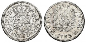 Carlos III (1759-1788). 1 real. 1765. México. M. (Cal 2019-415). Ag. 3,37 g. Cruces de puntos flaqueando el valor. Leves marquitas. EBC-. Est...120,00...