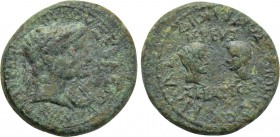 LYDIA. Magnesia ad Sipylum. Augustus with Livia, Gaius and Lucius (27 BC-14 AD). Ae. Dionysios Kilas, son of Dionysios, priest of Augustus.