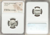 LUCANIA. Metapontum. Ca. 340-330 BC. AR nomos or stater (19mm, 3h). NGC VF. Veiled head of Demeter right, wearing barley wreath and pendant earring; Φ...