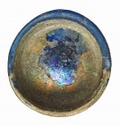 ROMA. Imperio Romano. Vidrio azul. Vasito con irisaciones. Diámetro: 6,2 cm. Altura: 3,1 cm. Siglos II-IV d.C.