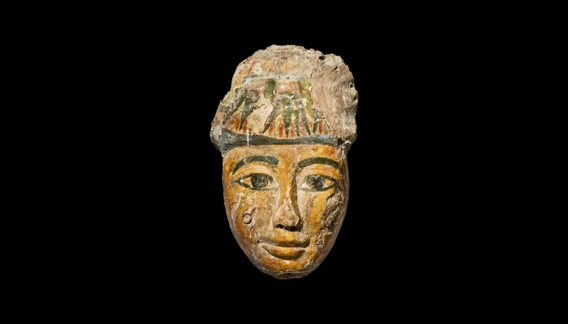An Egyptian polychrome wood coffin mask. 3rd intermediate period (1070-735 BC). ...