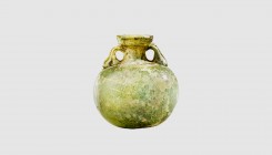 A Roman glass aryballos. 1st-2nd century AD. 6.6cm high. From an esteemed American collection

An aryballos is a small spherical, or globular, flask w...
