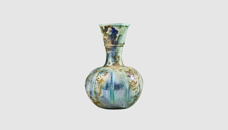 A Roman ribbed glass flask. 3rd-4th century AD. 15cm high. From an esteemed Amer...
