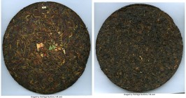 People's Republic Pu-erh Bingcha Tea Cake of 11 Ounces ND (c. 1950s-1970s) AU/UNC, Opitz-pg. 339. 87mm. 321.3gm. Both sides are blank with a small pap...