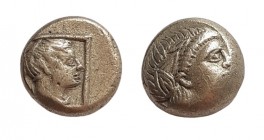 El Hekte
Lesbos, Mytilene, c. 377-326 BC. Wreathed head of Dionysos / Head of female r., drapery at neck, within linear square. Slightly off centre, ...