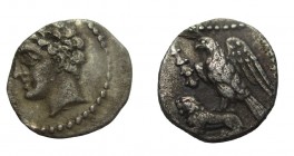 Obol AR
Cilicia, uncertain mint, c. 400 BC. Male head left, wearing grain wreath, within dotted border / Eagle standing left, spreading wings, on bac...