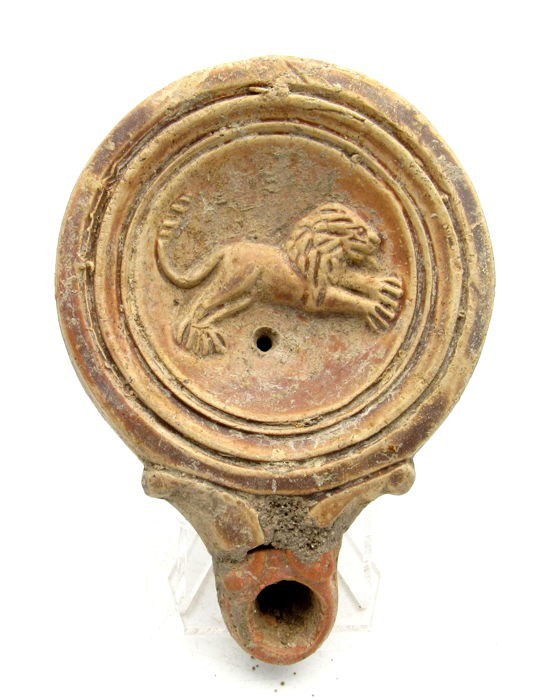 Roman terracotta lamp depicting a jumping lion, 1st - 3rd century A.D., 10 x 3 c...