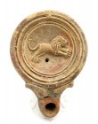Roman terracotta lamp depicting a jumping lion, 1st - 3rd century A.D., 10 x 3 cm