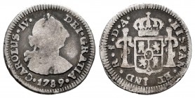 Carlos IV (1788-1808). 1/2 real. 1789. Santiago. DA. (Cal 2019-501). Ag. 1,61 g. Busto de Carlos III y ordinal IV. Rara. BC/BC+. Est...70,00.