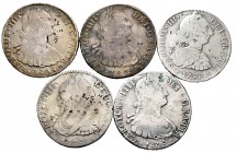 Lote de 5 monedas de 8 reales, cuatro de ellas con resellos orientales, 2 de Lima 1804, 1808, 2 de México 1785, 1788 y 1 de potosí 1808 con agujero ta...