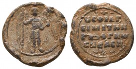 An anonymous byzantine lead seal (11th cent.)
Obverse: Archangel Michael standing, facial, nimbate, in military garments, holding a sceptre and crucig...