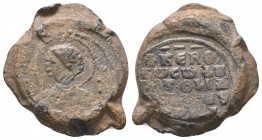Byzantine lead seal with saint George/inscription
(ca 12th cent.)
Obv.: Bust of saint George, facial, nimbate, holding spear and shield, his name in e...