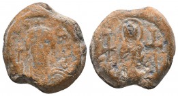 Imperial lead seal of byzantine emperor Phocas
(602-610)
Obv.: Bust of the emperor Phocas, facial, wearing chimation and crown, holding cruciger globu...