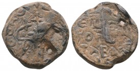 Uncertain byzantine lead seal
(10th cent.)
Obv.: Patriarchal cross with floral decoration, circular invocative inscription +Κ(ΥΡΙ)Ε ΒΟΗΘΕΙ ΤΩ CΩ ΔΟΥΛΩ...