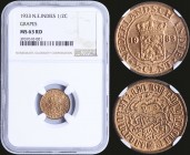 NETHERLANDS EAST INDIES: 1/2 Cent (1933) in bronze with crowned arms divide date within circle. Mintmasters mark: Grapes. Inside slab by NGC "MS 63 RD...