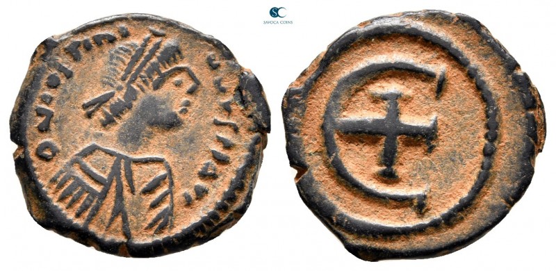 Justinian I AD 527-565. Theoupolis (Antioch)
Pentanummium Æ

17 mm., 2,25 g....