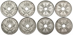 MONEDAS EXTRANJERAS. Lote compuesto por 4 monedas de 1 Schilling de Nueva Guinea de diferentes años. A EXAMINAR.