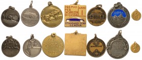 Lotto di 7 medaglie con soggetti vari in maggioranza automobilistico (la piccola con S. Cristoforo é in oro g. 1,00 tit. 750)