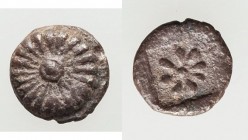 IONIA. Erythrae (?). Ca. 600-550 BC. AR tetartemorion (6mm, 0.28 gm). VF. Raised rosette with central boss / Star with eight rays within incuse square...