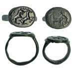ROMA. Imperio Romano. III-IV d.C. Bronce. Lote de 2 anillos: uno con representación de león cazando ciervo, otro con representación de un pastor con u...