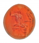 ROMA. Imperio Romano. I-II d.C. Cornalina. Entalle con representación de Júpiter entronado, sujetando una Victoria. Altura 12 mm