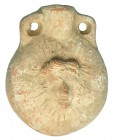 ROMA. Imperio Romano. I-IV d.C. Terracota. Ampulla con representación frontal de Helios en ambas caras. Altura 8,8 cm.