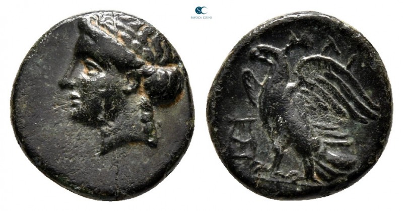Caria. Halikarnassos 350-200 BC. 
Bronze Æ

11 mm, 1,23 g

Laureate head of...