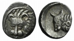 Caria, Uncertain, c. 400 BC. AR Hemiobol (6mm, 0.40g, 12h). Facing lion’s head, turned slightly l. R/ Bull’s head l., letter or symbol on neck. Troxel...