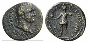 Vespasian (69-79). Aeolis, Kyme. Æ (19mm, 3.38g, 6h). Eprius Marcellus, procos. Laureate head r. R/ The Amazon Kyme standing l., holding globe and tri...