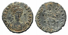 Arcadius (383-408). Æ (17mm, 2.26g, 6h). Constantinople, 401-3. Helmetd and cuirassed bust facing, holding spear. R/ Concordia seated facing, foot set...