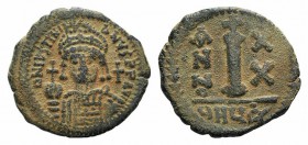 Justinian I (527-565). Æ 10 Nummi (23mm, 4.60g, 6h). Theoupolis (Antioch), year 20 (546/7). Helmeted and cuirassed bust facing, holding globus crucige...