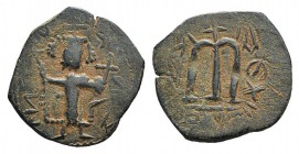 Islamic, Arab-Byzantine, c. 7th century. Æ Fals (23mm, 3.30g, 3h). Uncertain mint. Emperor standing facing, holding long cross and globus cruciger. R/...
